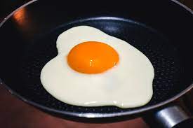 Eggs frying in a saucepan