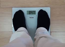 Man weighing himself