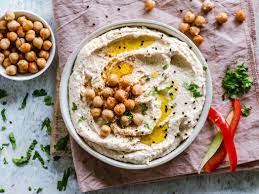 Tub of Humus with Chick Pies