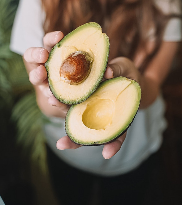 Woman Holding a Avocado