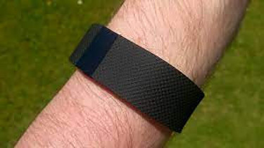 Person Waring Fitbit sports watch