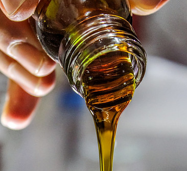 Olive Oil being poured into a glass